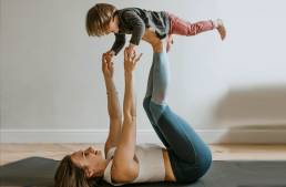 A mother and child doing yoga together